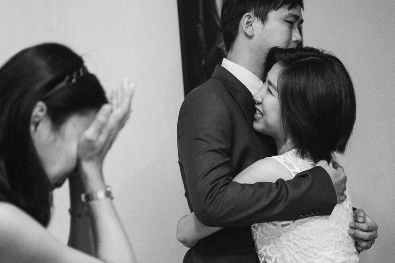 Tear of joy and blessing from the sisters to the groom